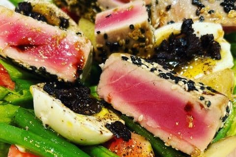 Close-up of ahi tuna niçoise salad with vegetables
