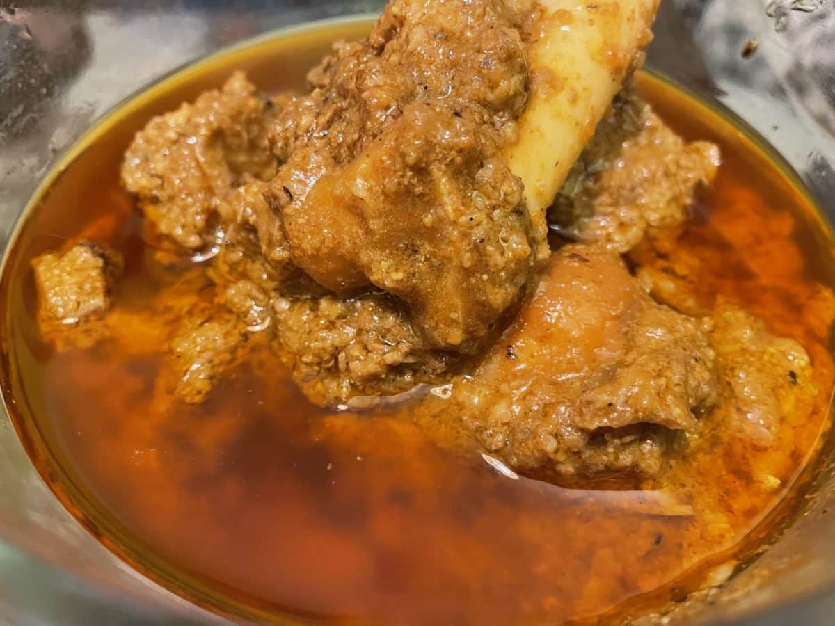 A serving of Mutton Quorma with visible pieces of mutton.