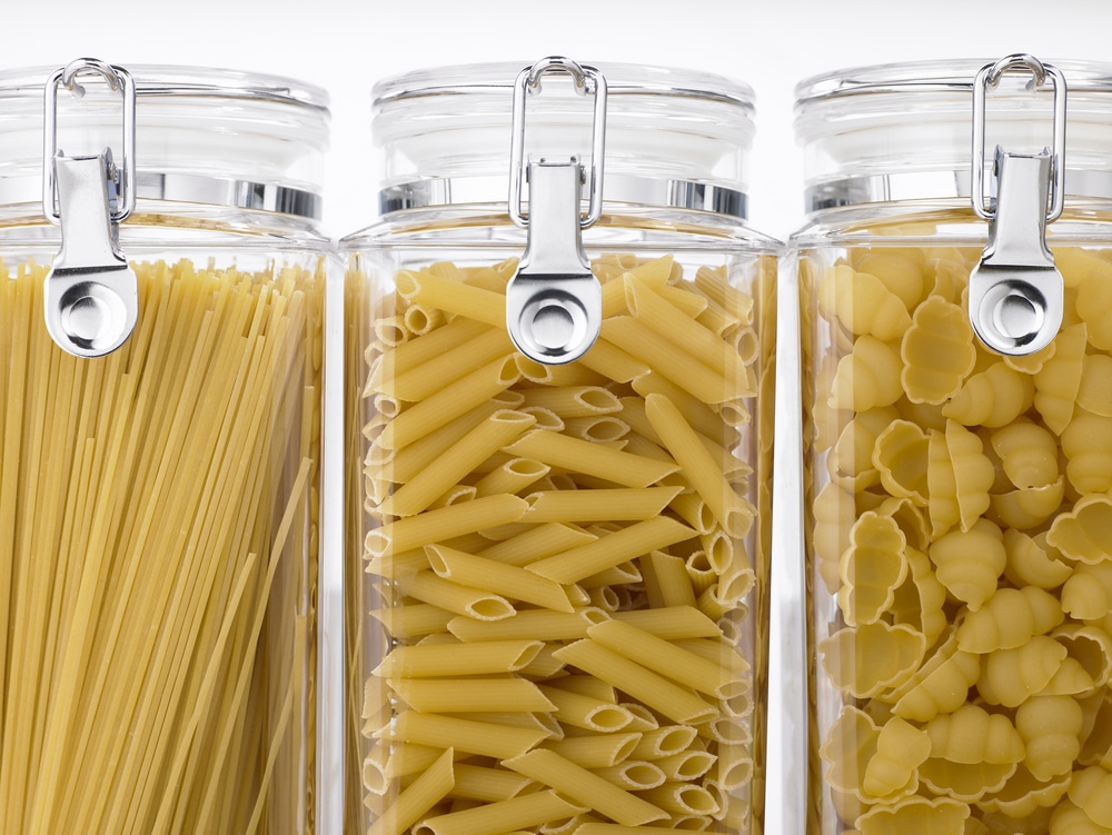 Variety of dried pasta in glass storage jars