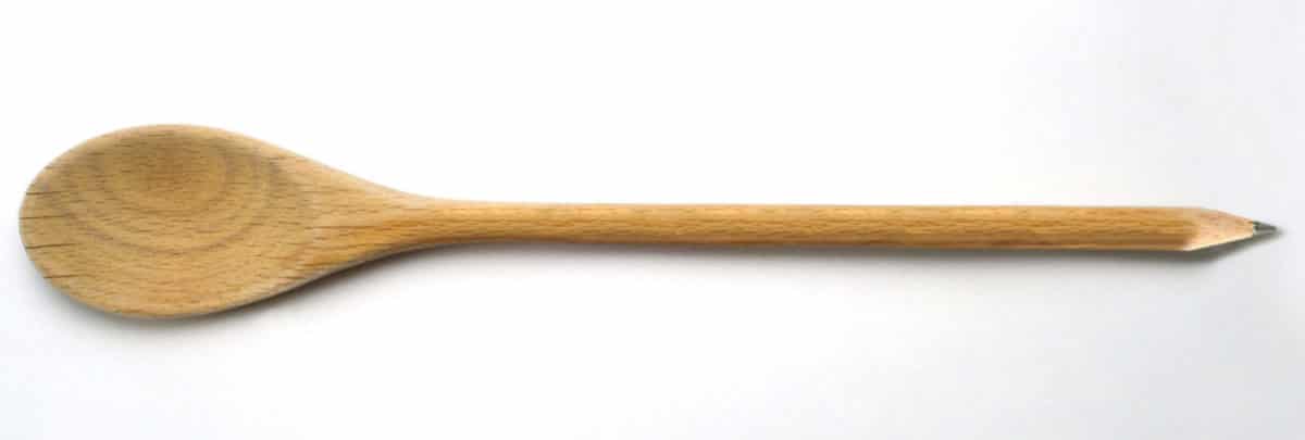 Close-up of a wooden spoon carved to resemble the tip of a pencil.