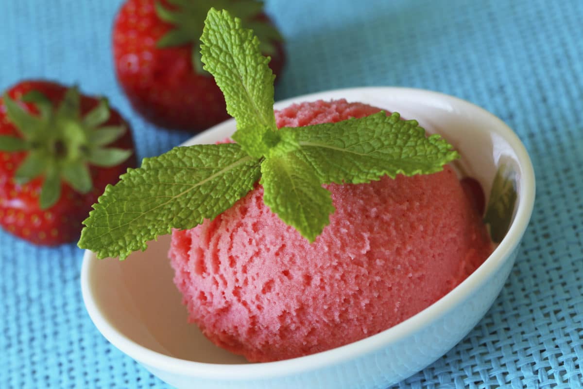 Close-up of strawberry granita garnished with fresh mint