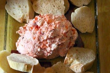A creamy smoked salmon cheese dip with bread pieces
