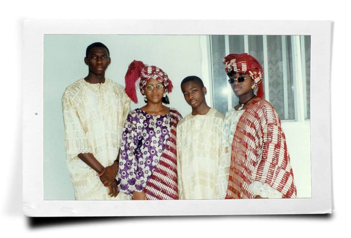 A Nigerian family of four dressed in traditional attire.