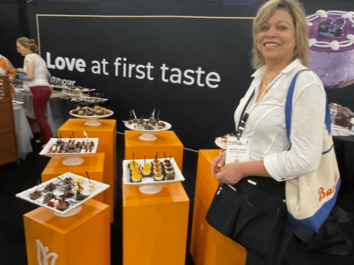 Denise at booth at Summer Fancy Food Show
